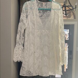 Free People White Lace dress with lace print. 
Size small , brand new w tag.